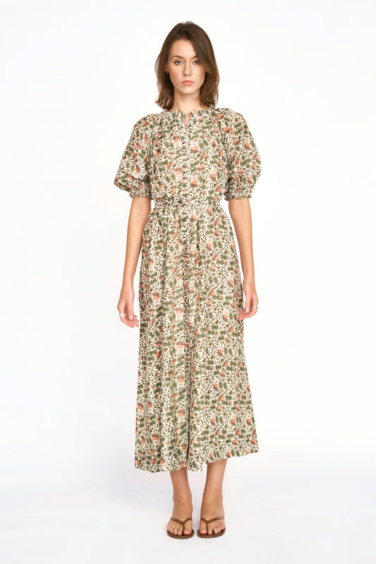 Pink cotton maxi dress on a hanger in store