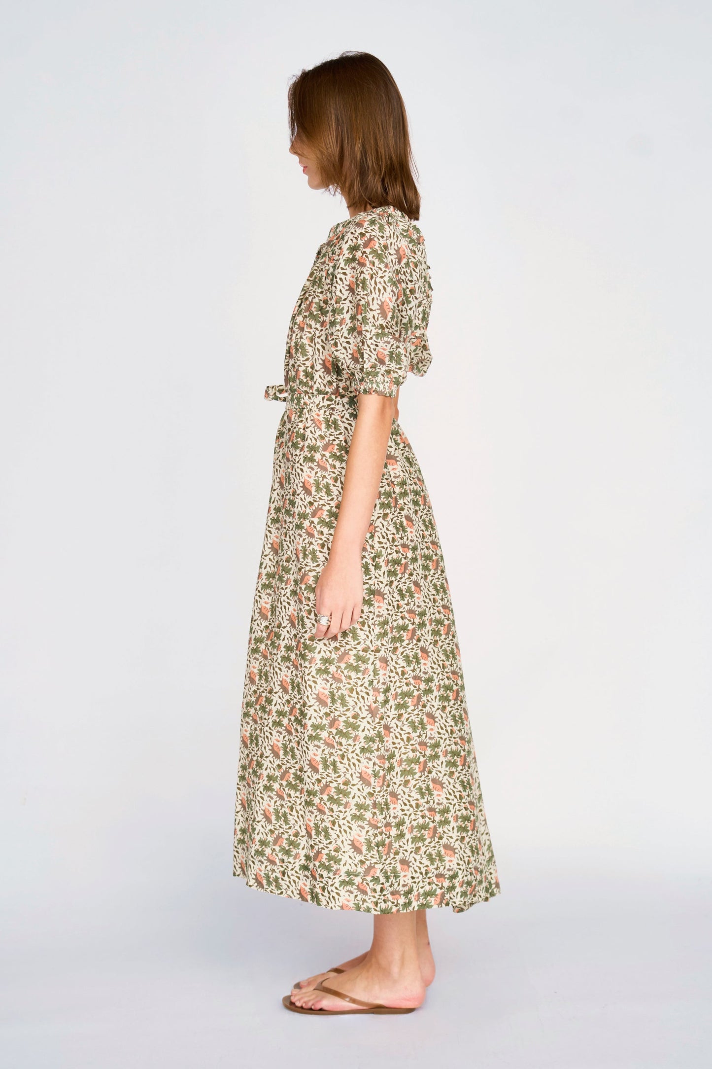 Pink cotton maxi dress on a hanger in store