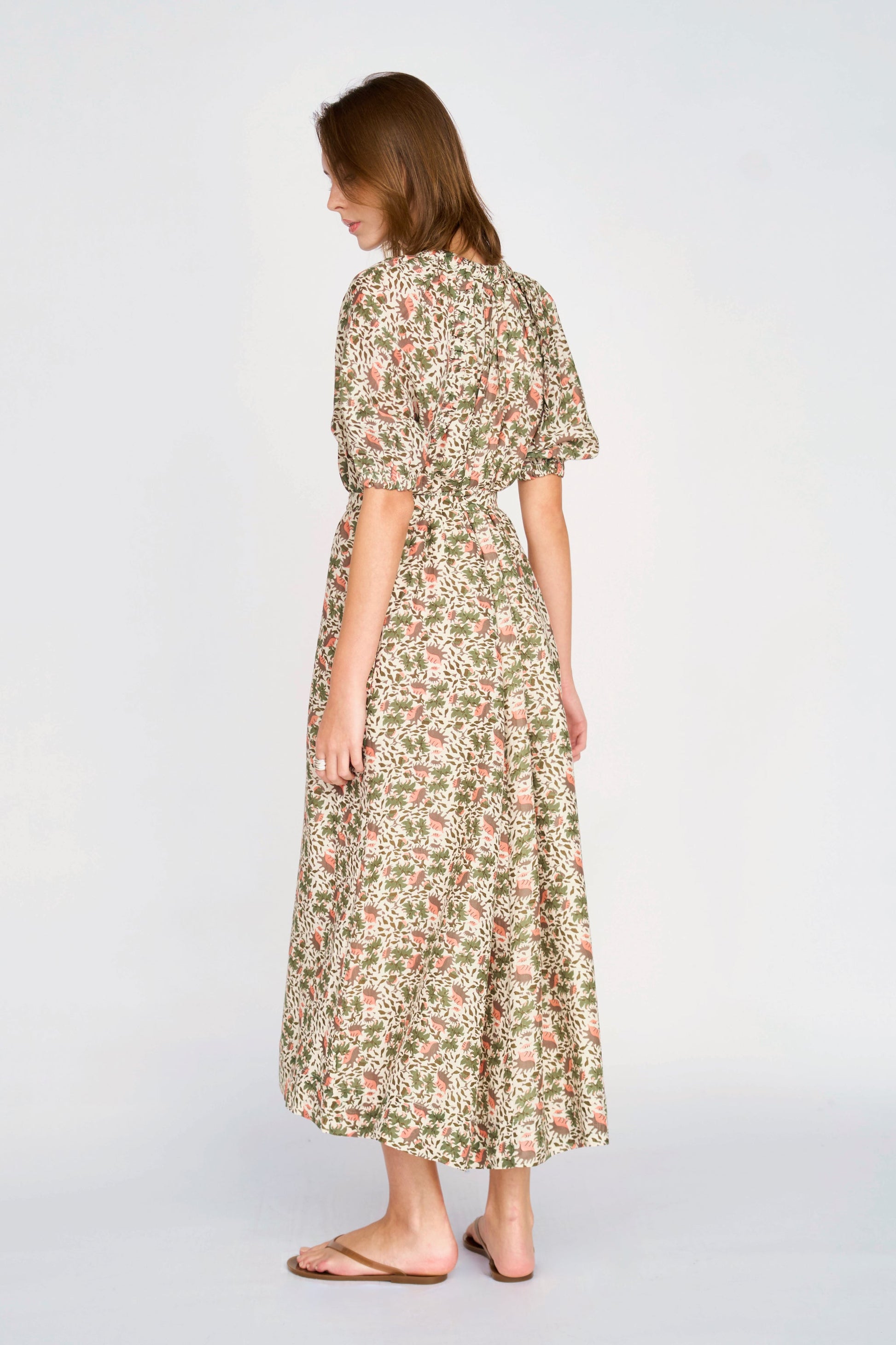 Pink cotton maxi dress on a hanger in store