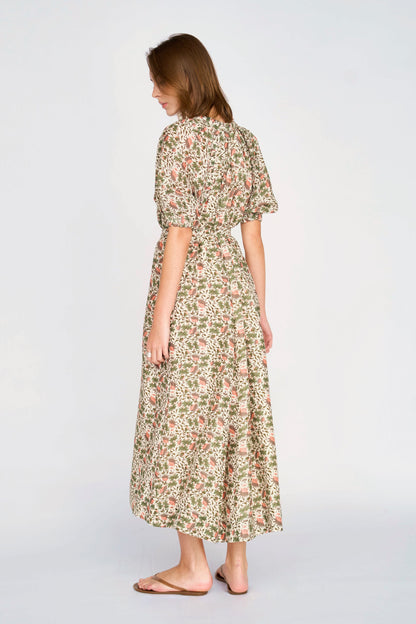 Pink cotton maxi dress on a hanger in store
