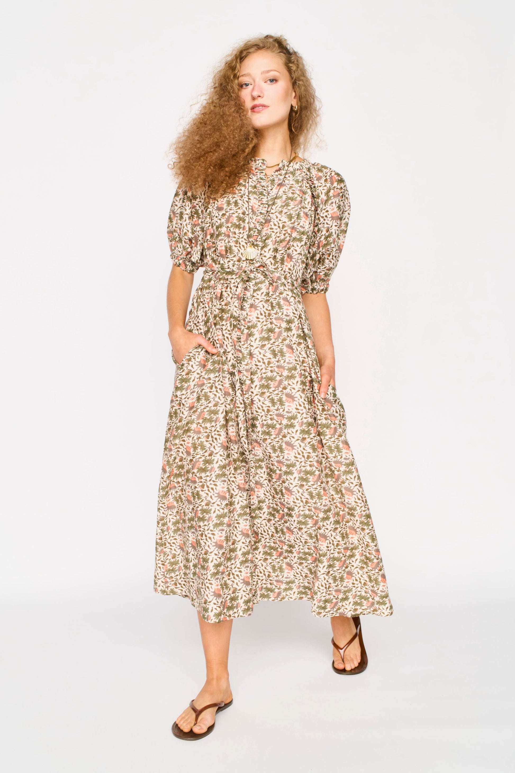 Pink cotton maxi dress on a hanger in store