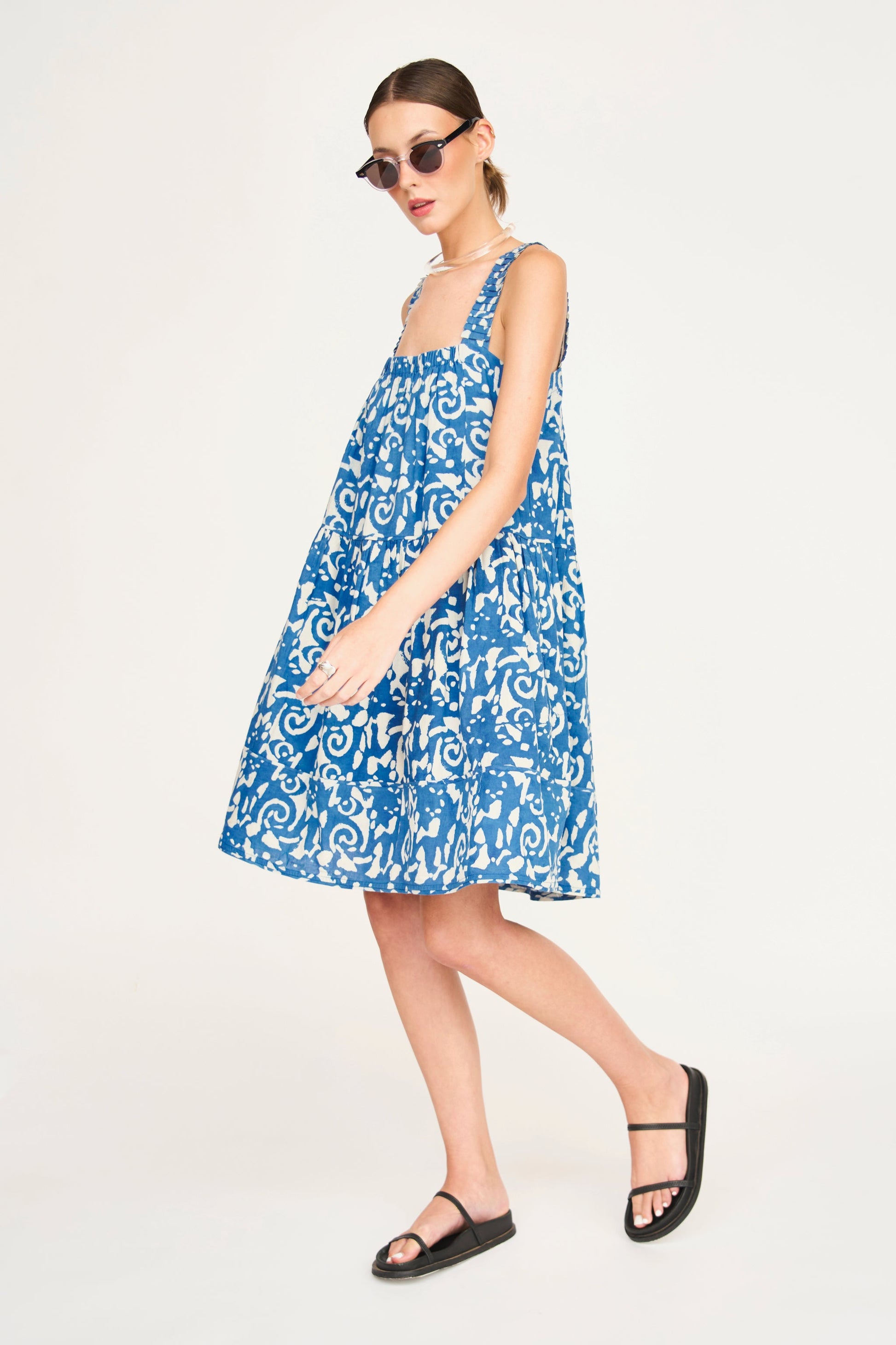 Indigo cotton short dress on a hanger in store
