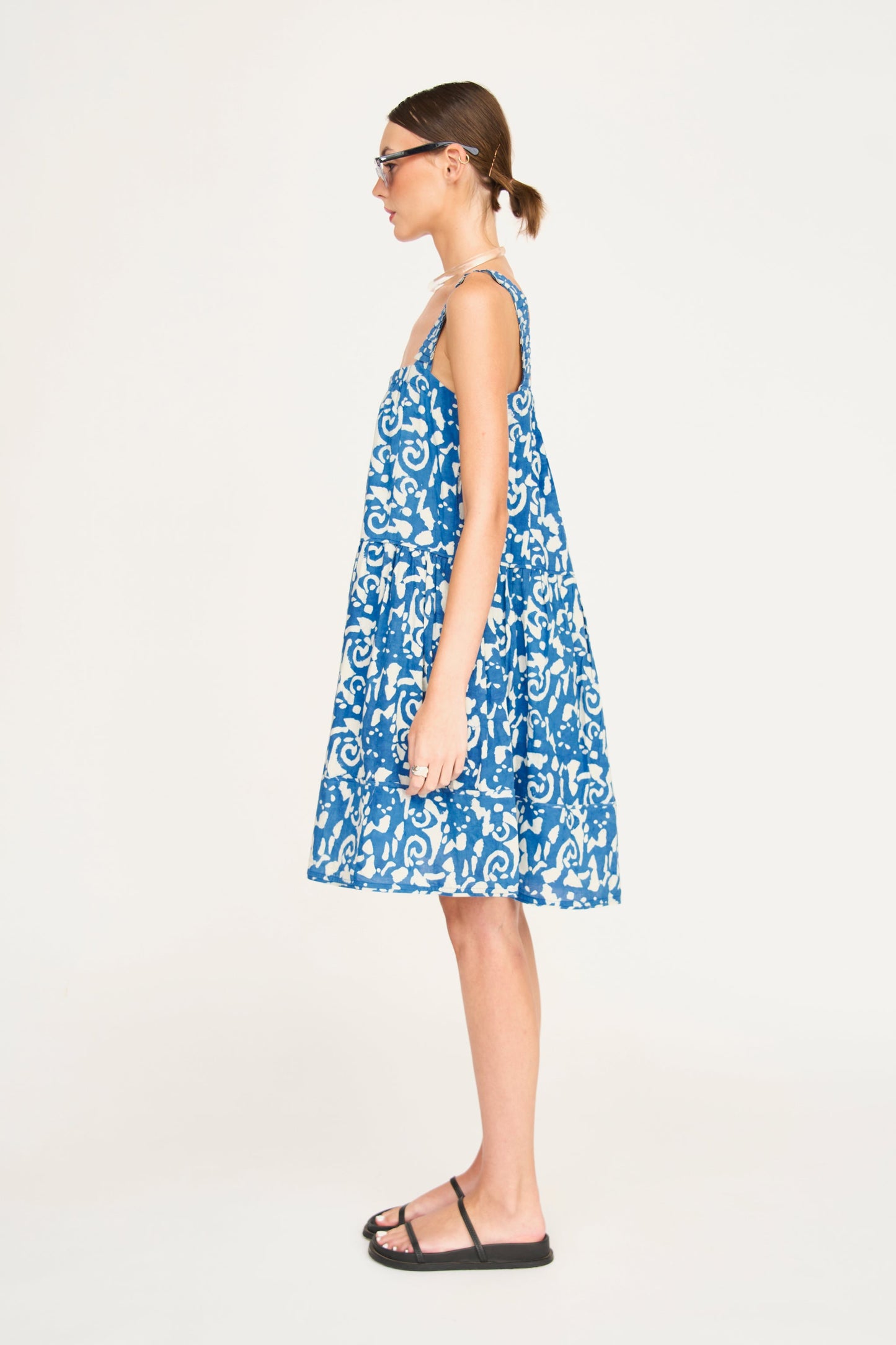 Indigo cotton short dress on a hanger in store