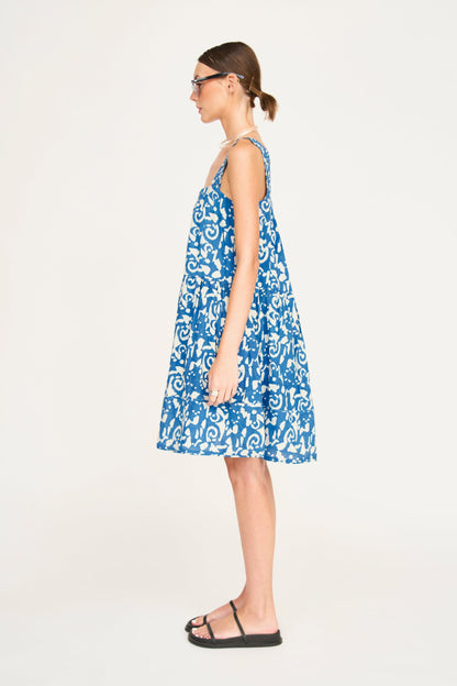 Indigo cotton short dress on a hanger in store