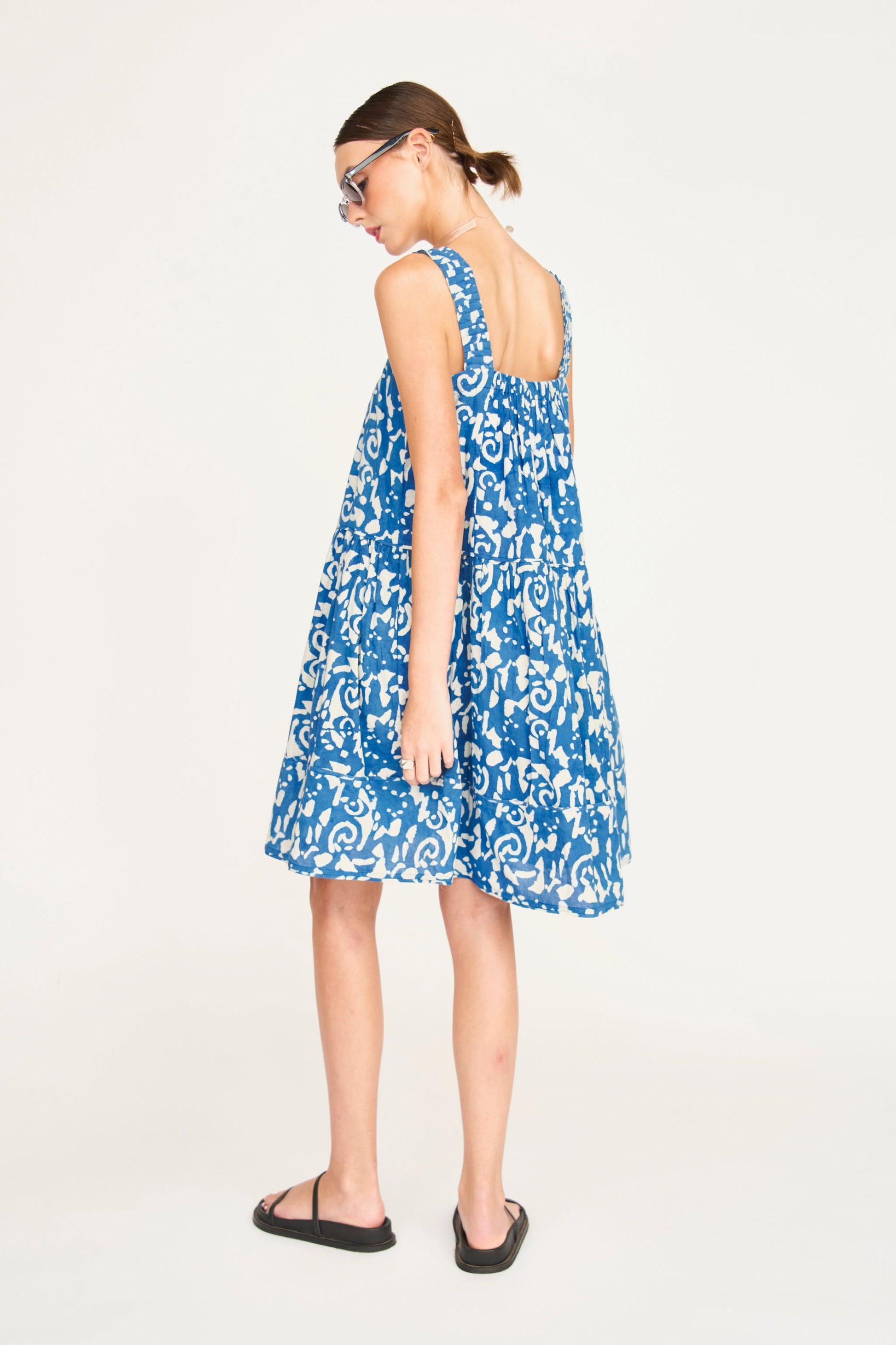 Indigo cotton short dress on a hanger in store