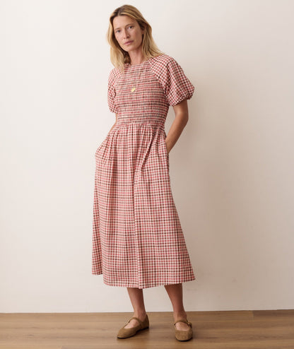 Blue smocked dress on a hanger in store