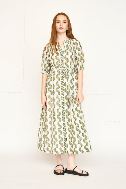 Green cotton maxi dress on a hanger in store