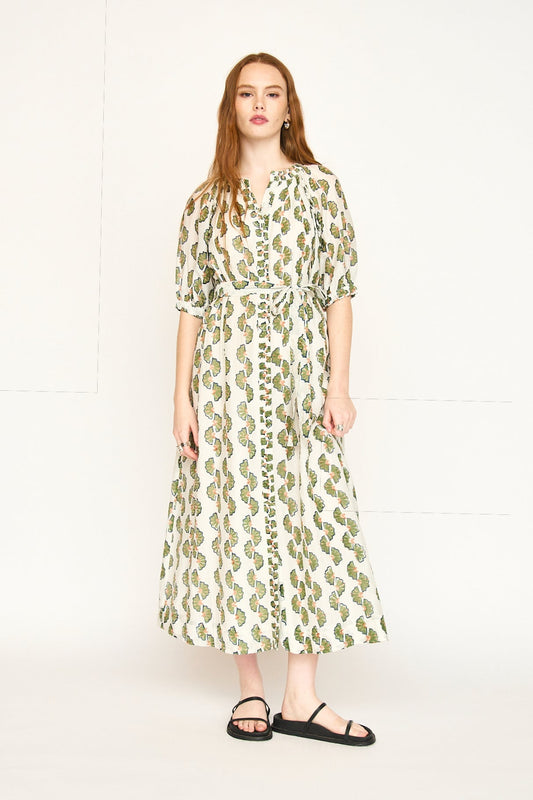 Green cotton maxi dress on a hanger in store