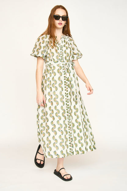 Green cotton maxi dress on a hanger in store