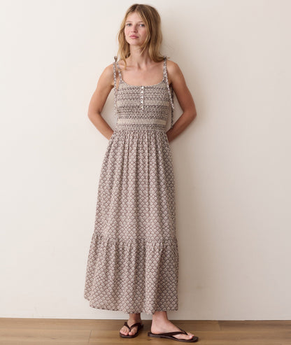 Brown smocked dress on a hanger in store