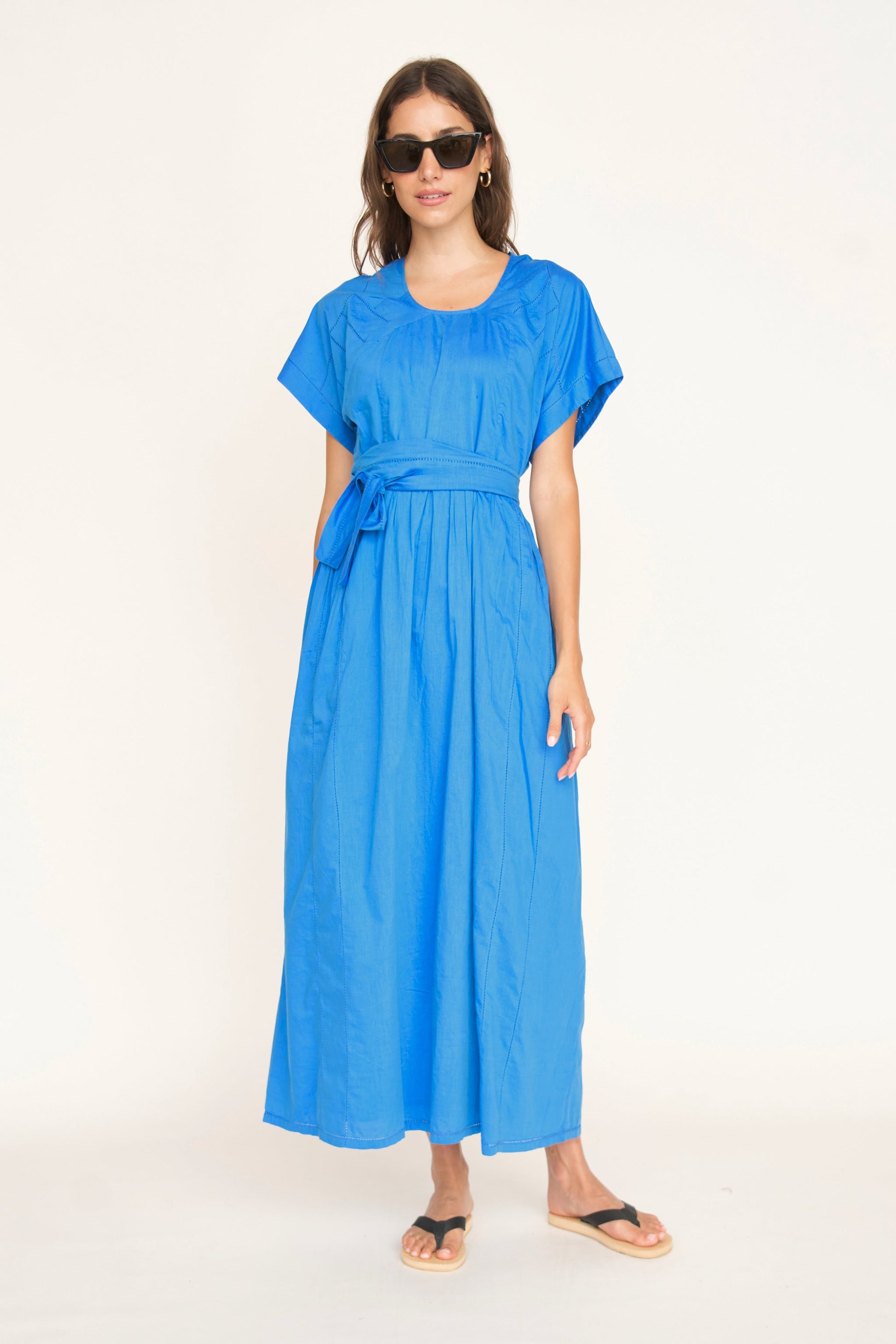 Blue cotton dress on a hanger in store