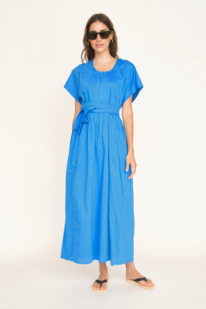 Blue cotton dress on a hanger in store