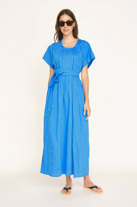 Blue cotton dress on a hanger in store