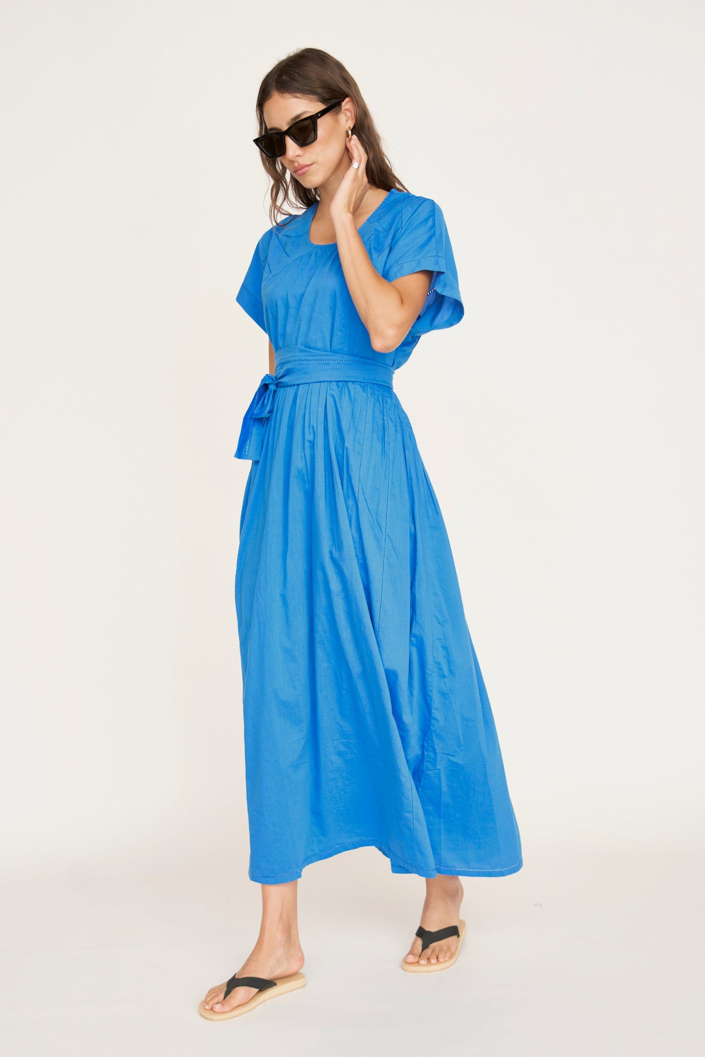 Blue cotton dress on a hanger in store