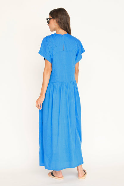 Blue cotton dress on a hanger in store