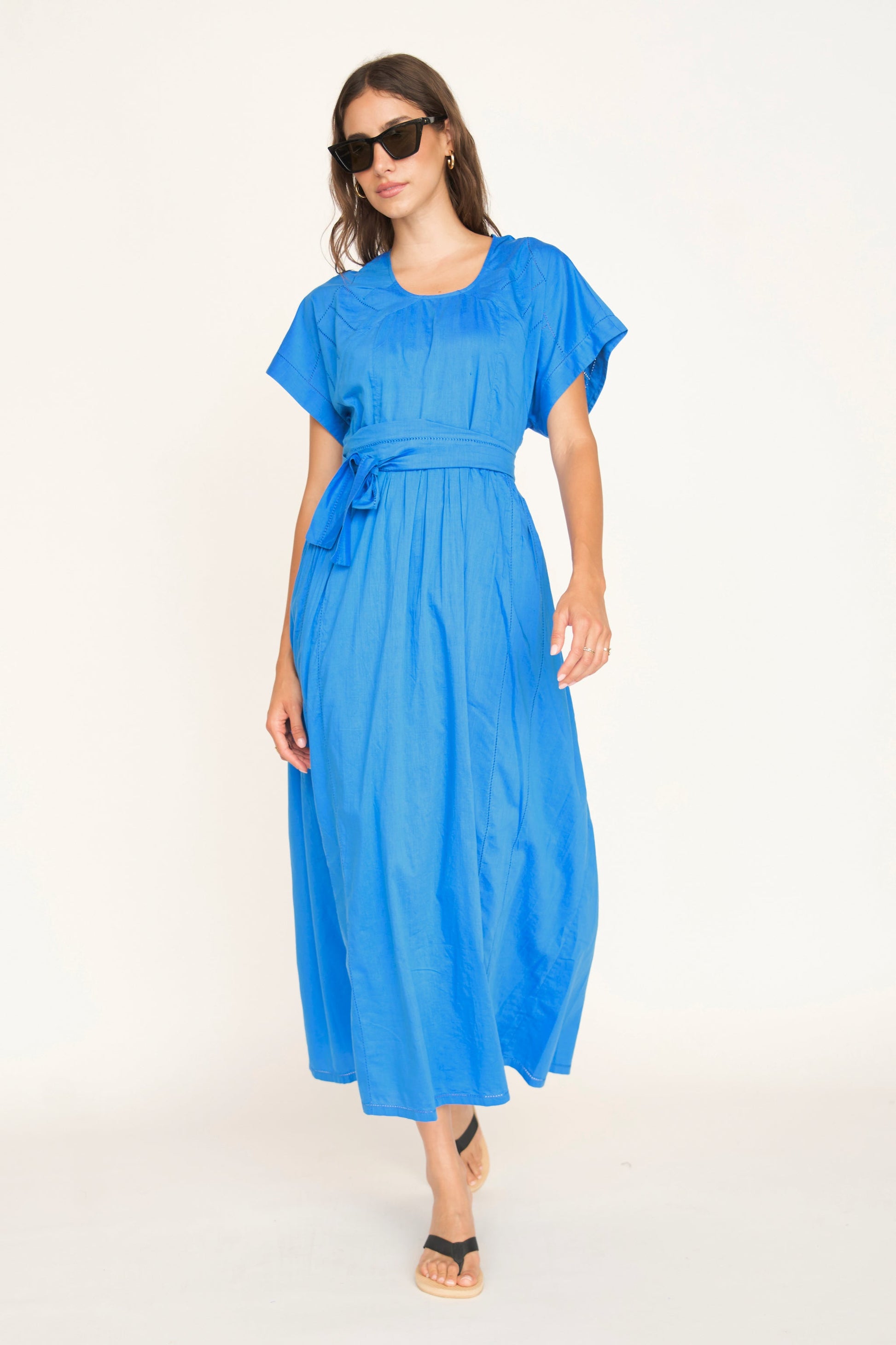 Blue cotton dress on a hanger in store