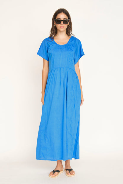 Blue cotton dress on a hanger in store