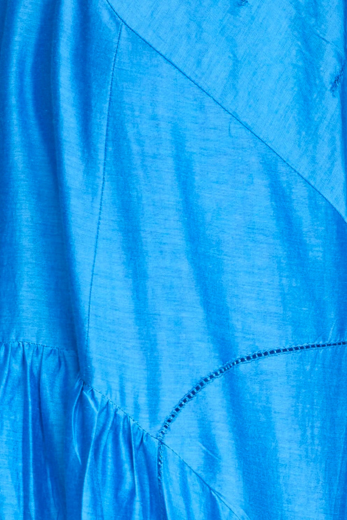 Blue cotton dress on a hanger in store