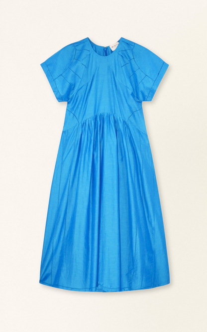 Blue cotton dress on a hanger in store