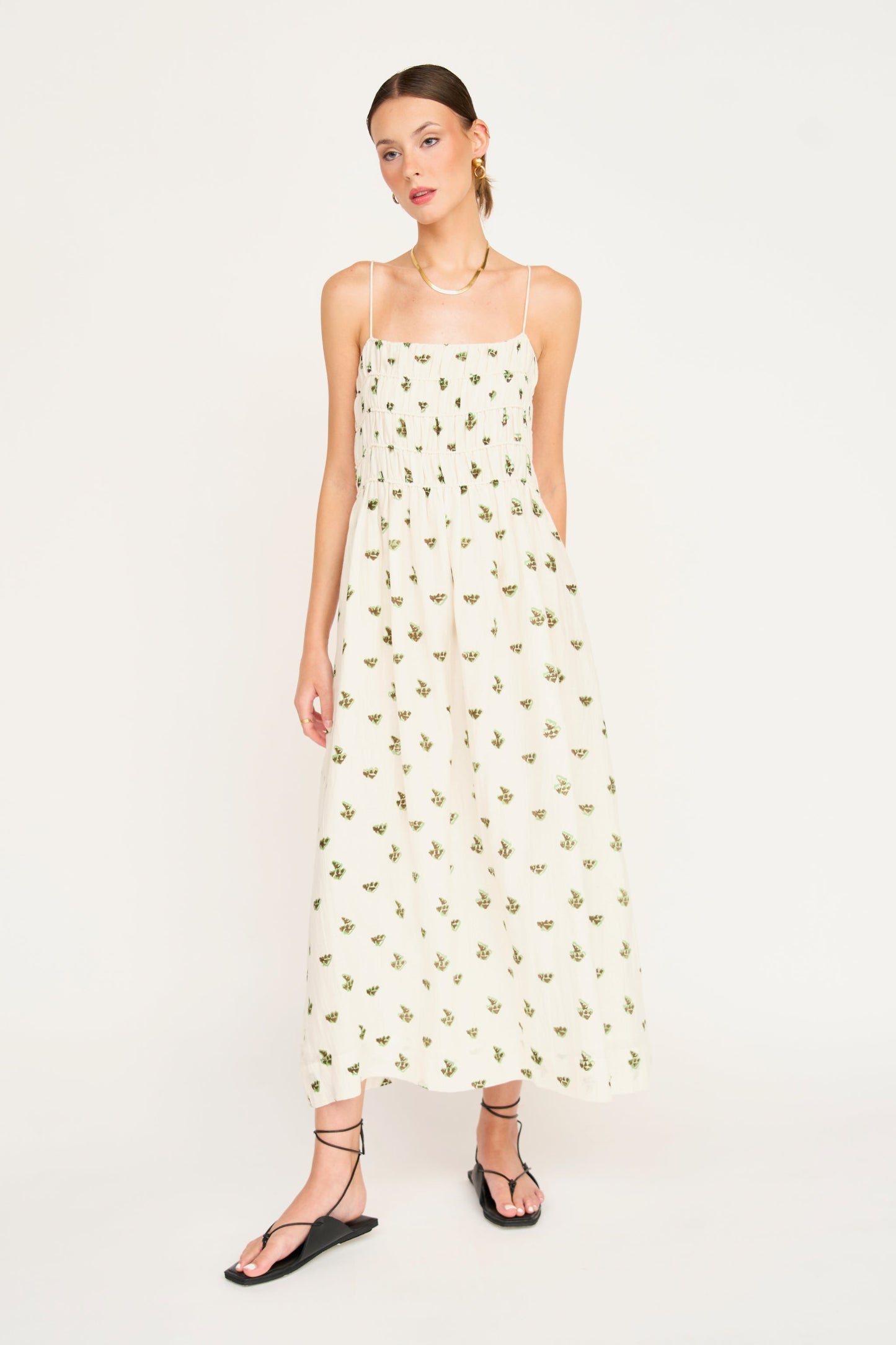 Brown cotton midi dress on a hanger in store