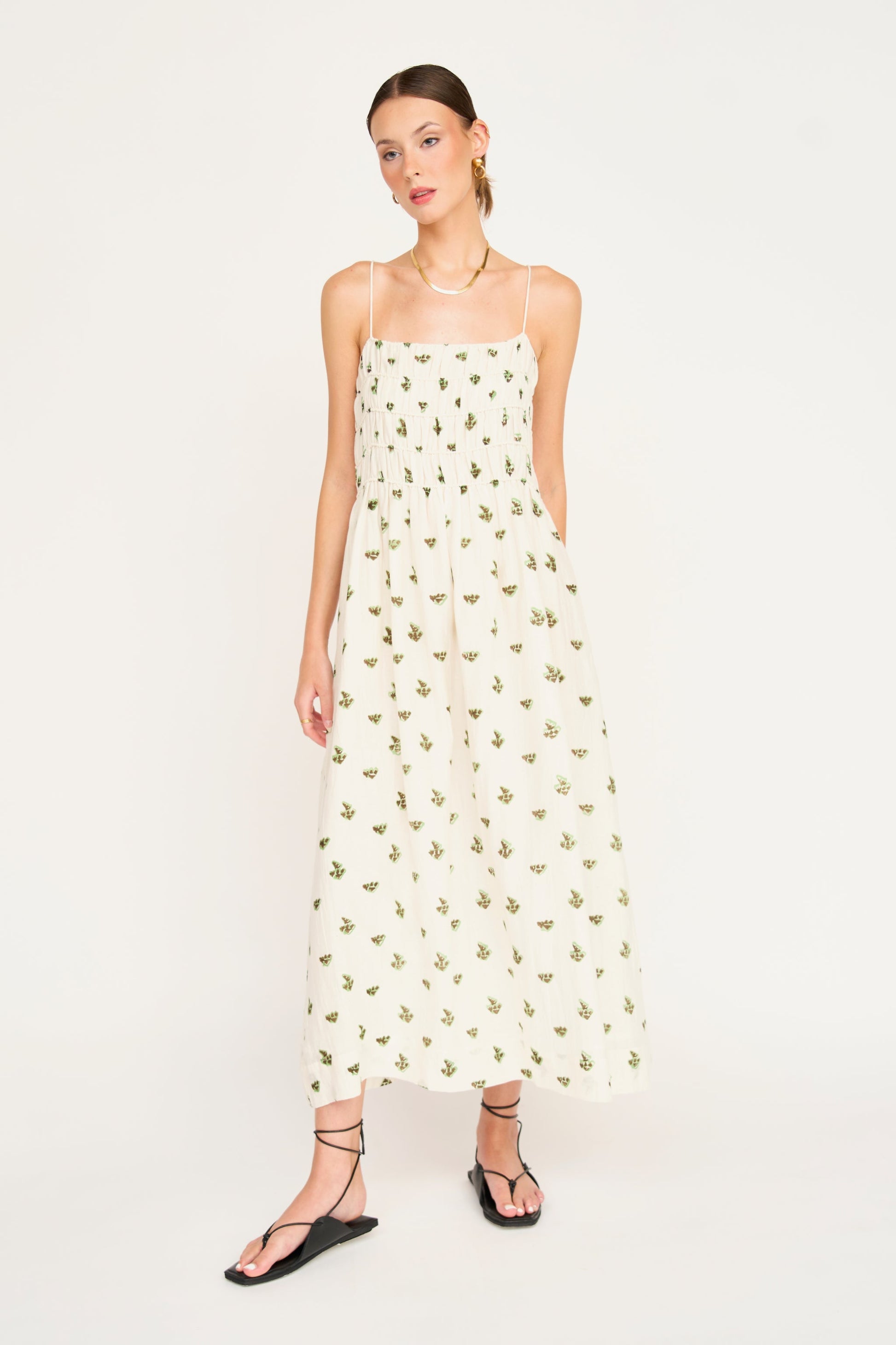 Brown cotton midi dress on a hanger in store
