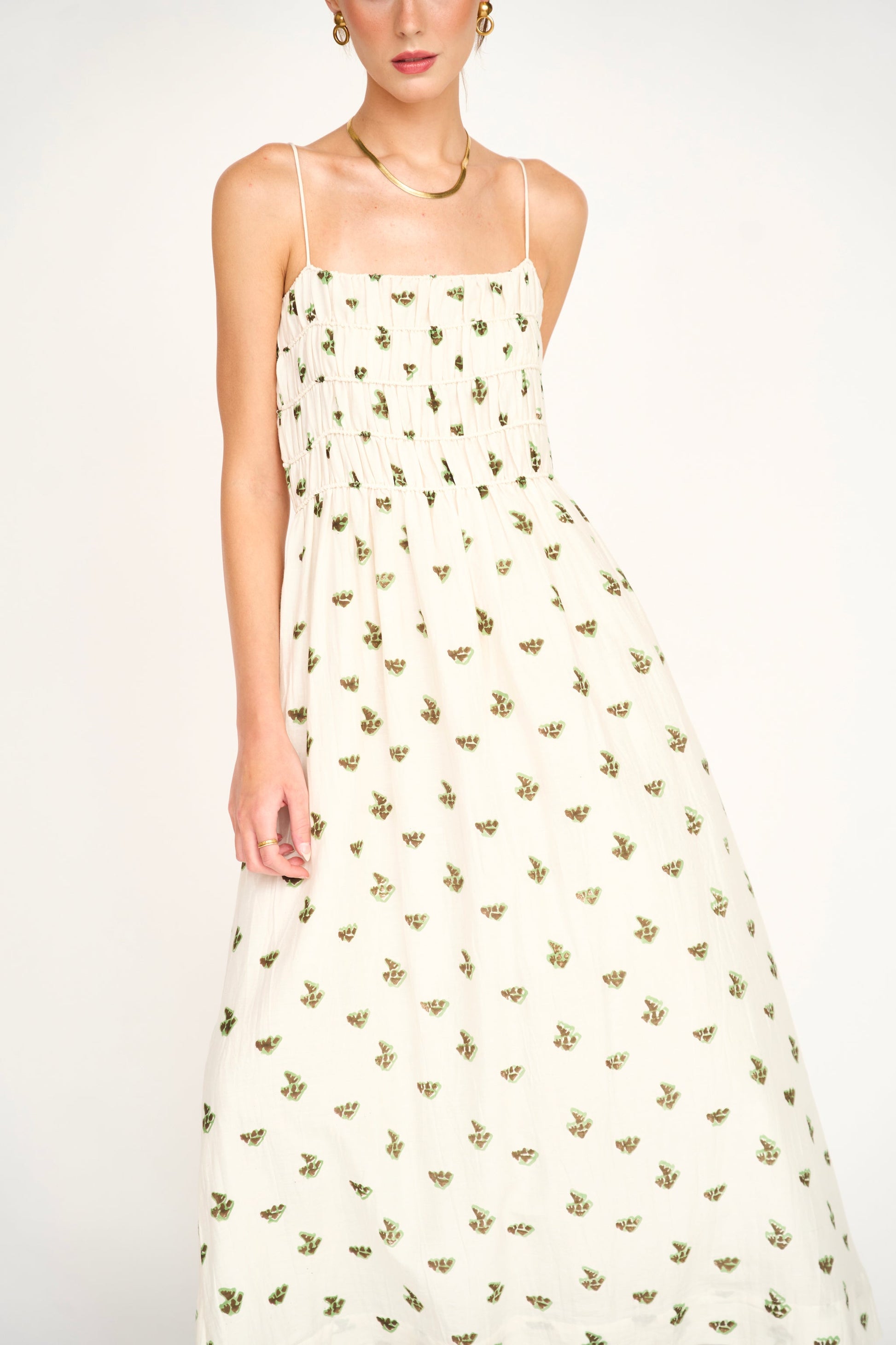 Brown cotton midi dress on a hanger in store