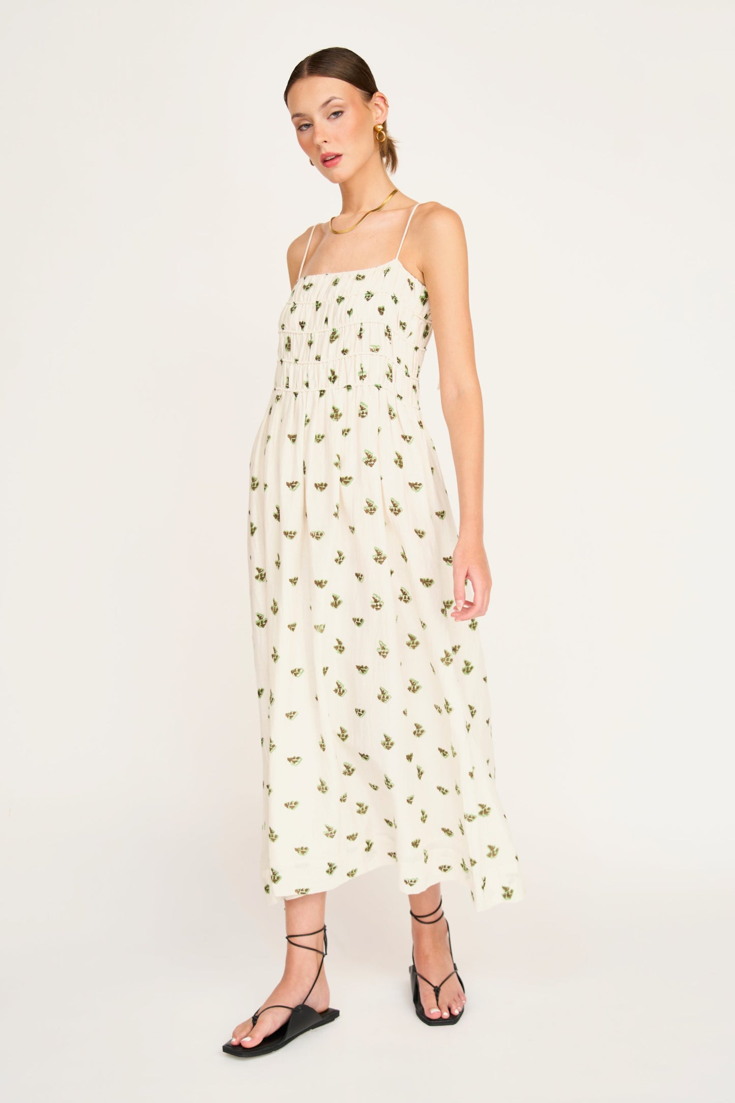 Brown cotton midi dress on a hanger in store