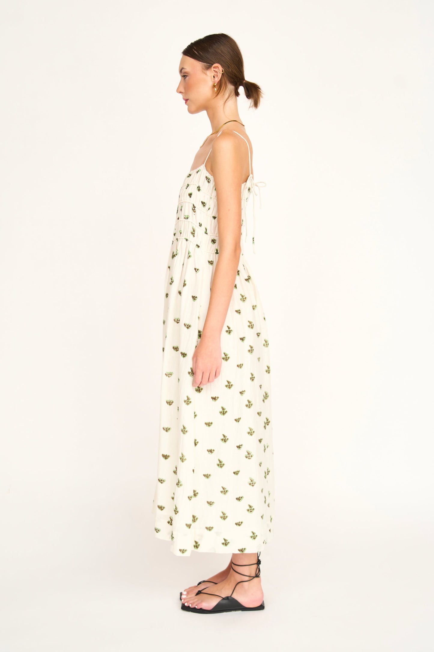 Brown cotton midi dress on a hanger in store