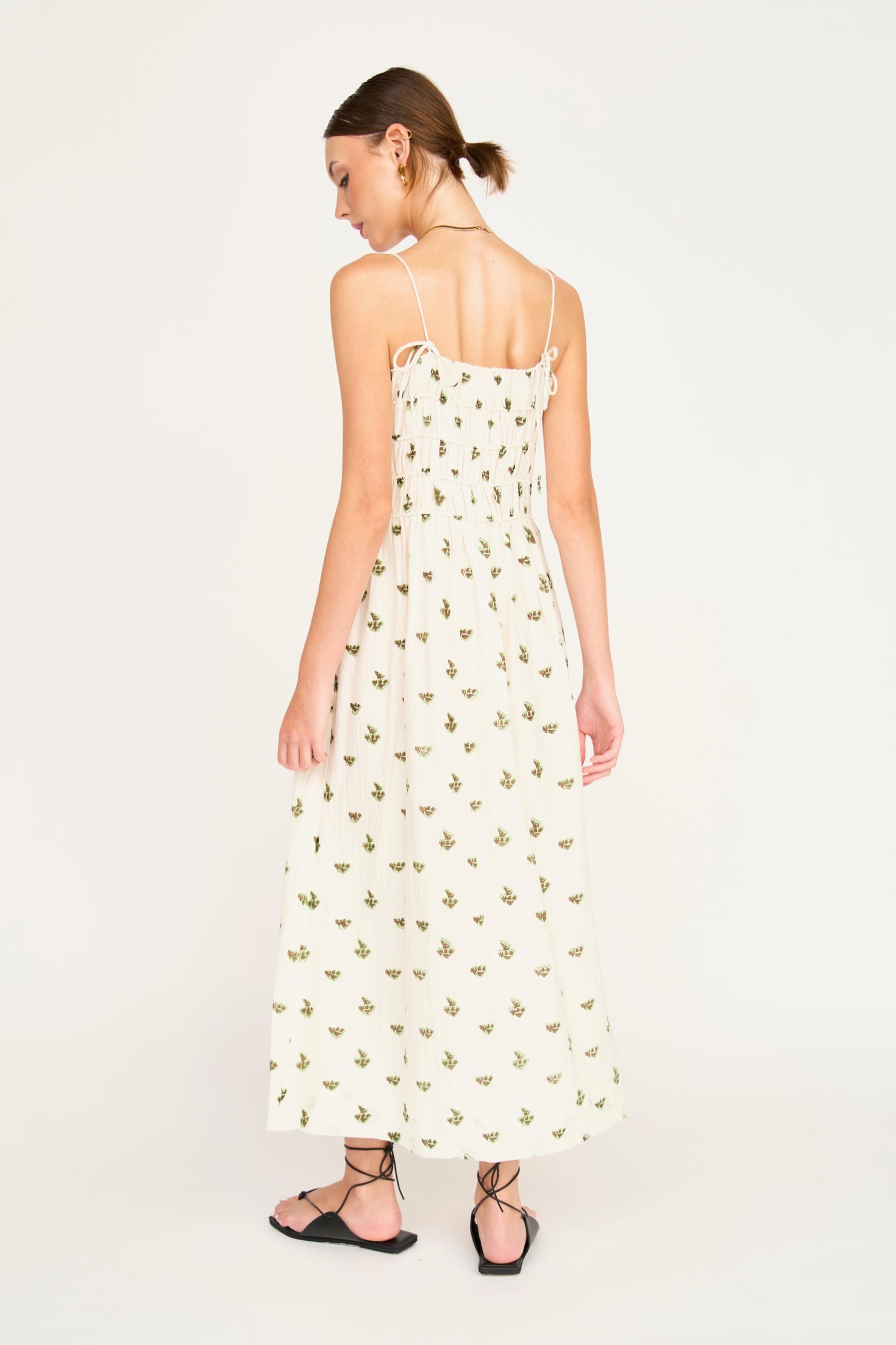 Brown cotton midi dress on a hanger in store