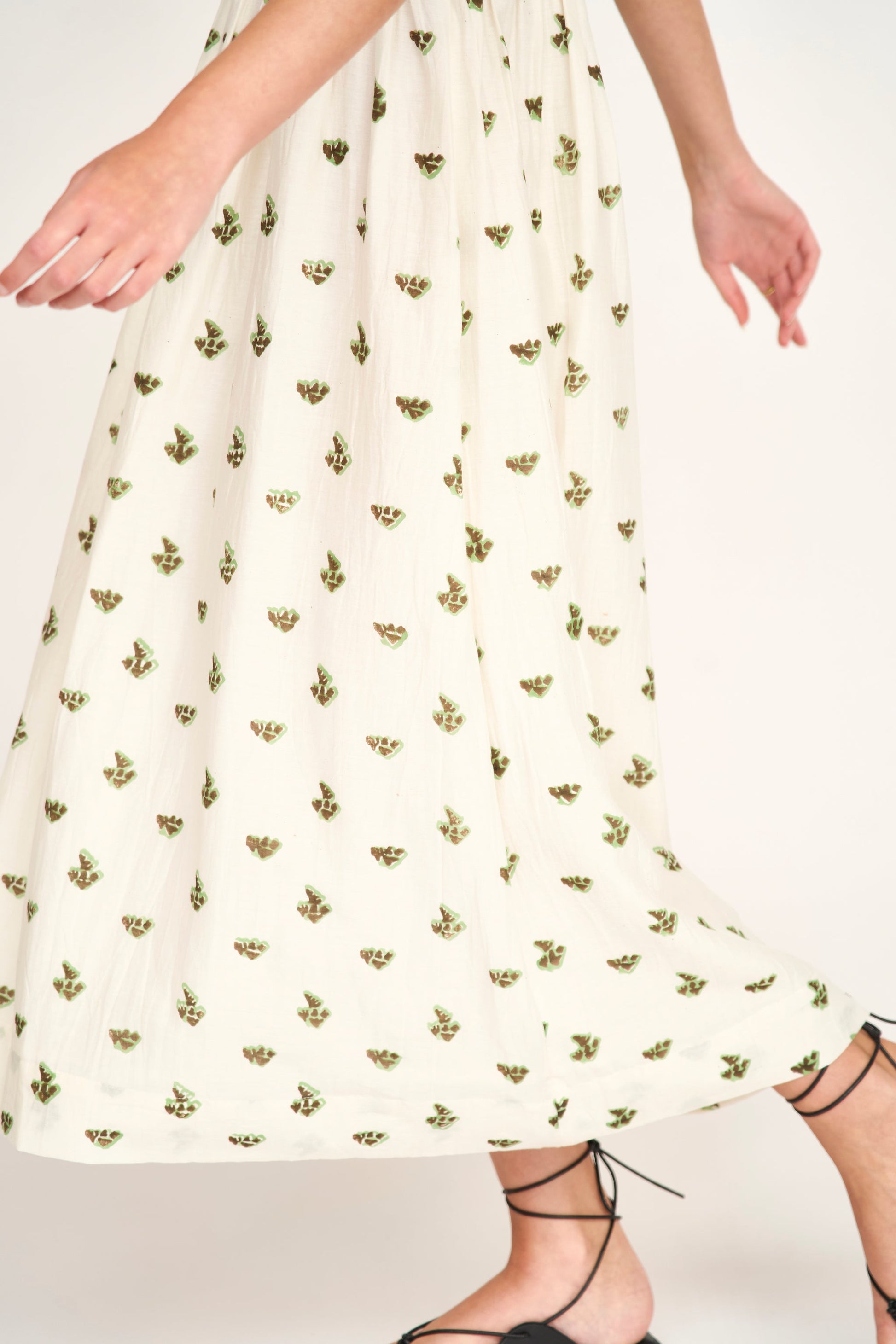 Brown cotton midi dress on a hanger in store