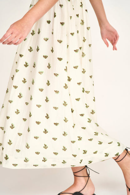 Brown cotton midi dress on a hanger in store