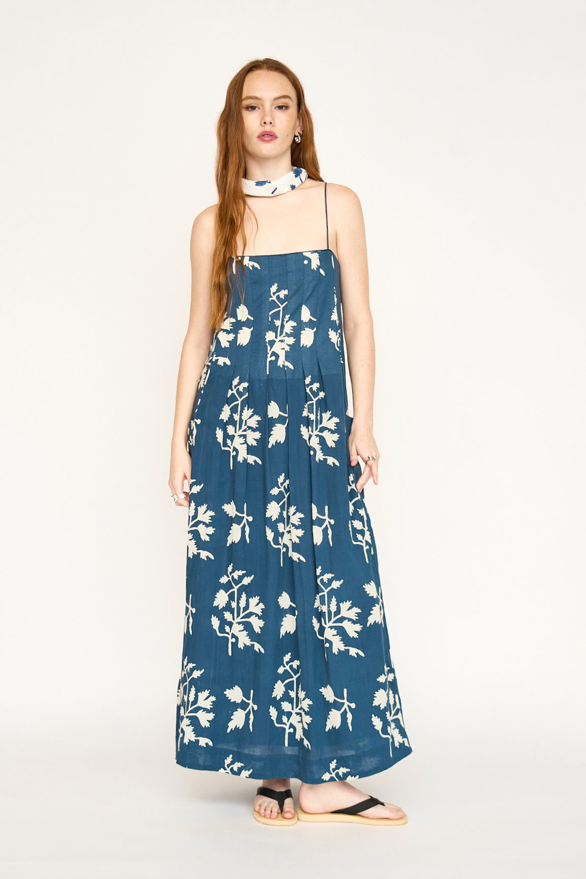 Blue cotton maxi dress on a hanger in store