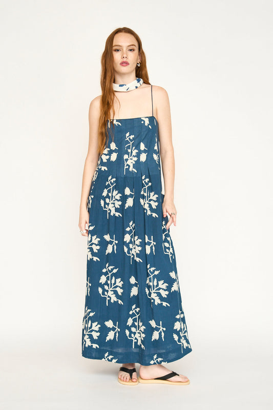 Blue cotton maxi dress on a hanger in store