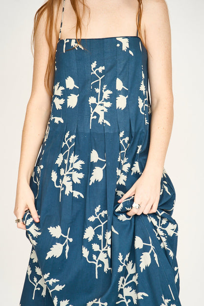 Blue cotton maxi dress on a hanger in store