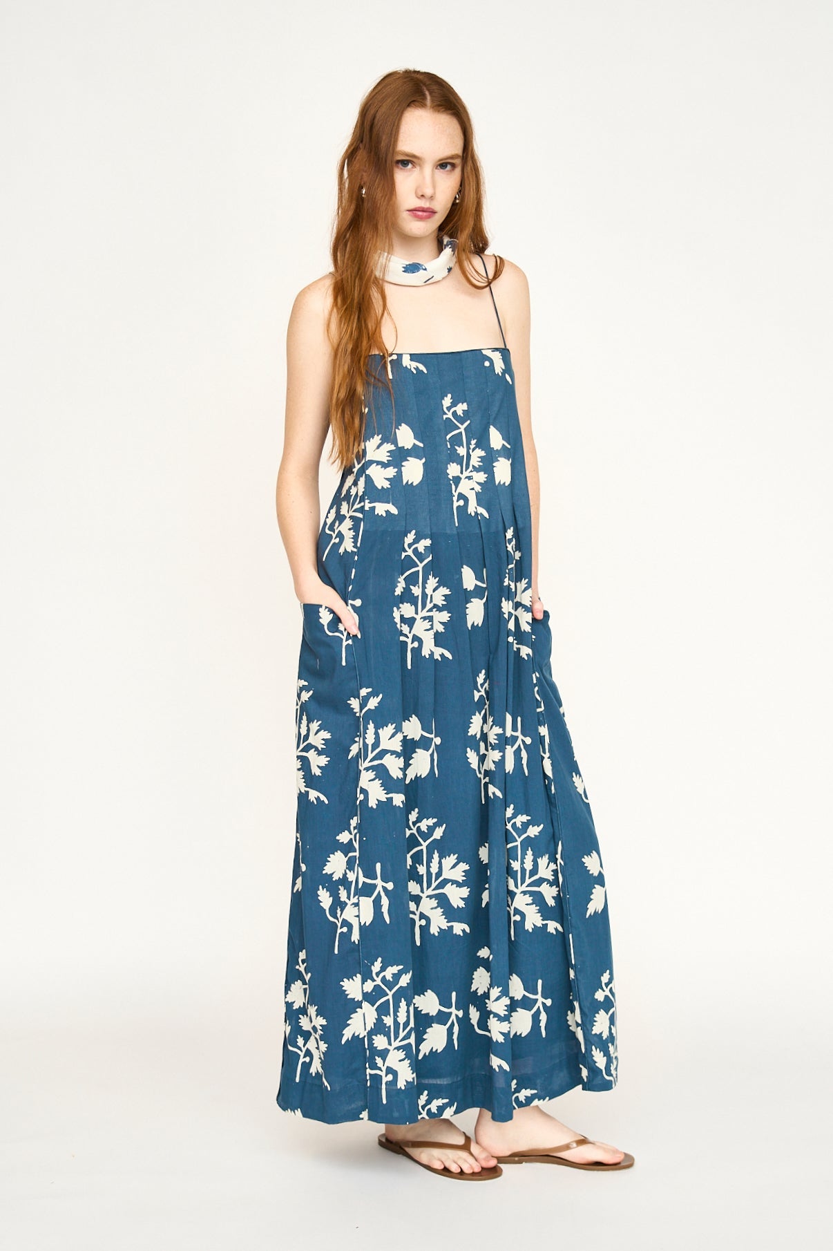Blue cotton maxi dress on a hanger in store