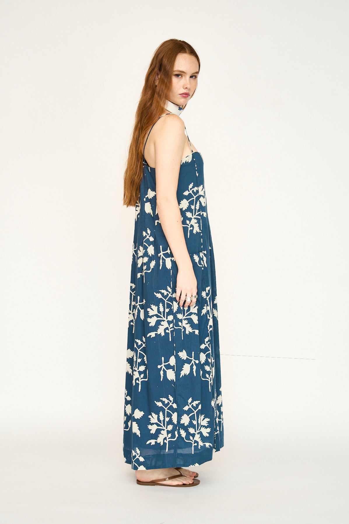Blue cotton maxi dress on a hanger in store