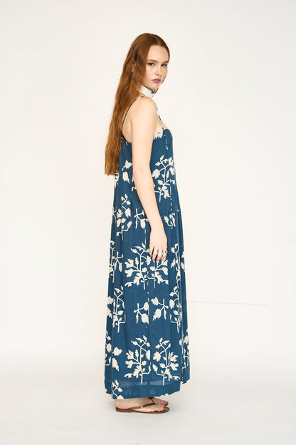 Blue cotton maxi dress on a hanger in store