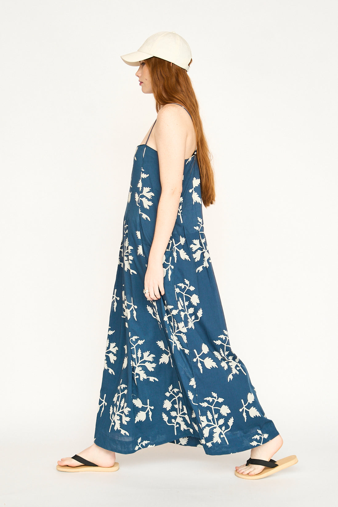 Blue cotton maxi dress on a hanger in store