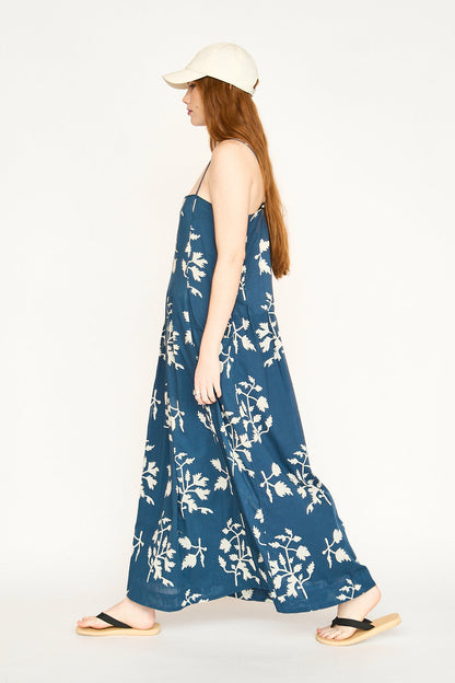 Blue cotton maxi dress on a hanger in store