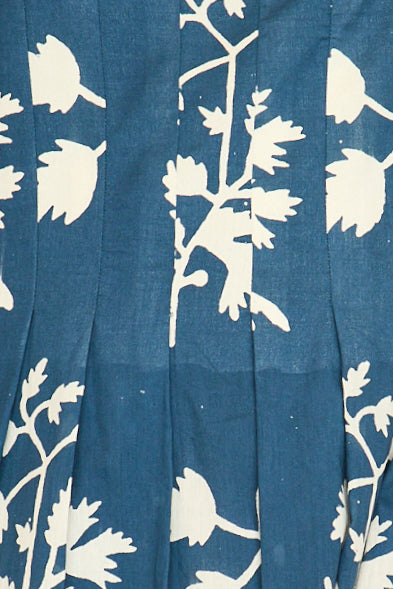Blue cotton maxi dress on a hanger in store