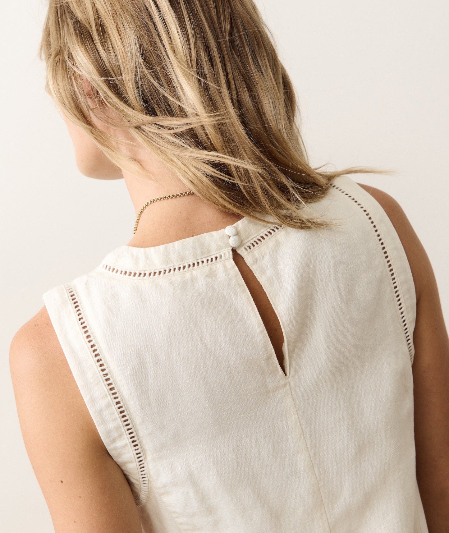 Linen mini dress on a hanger in store
