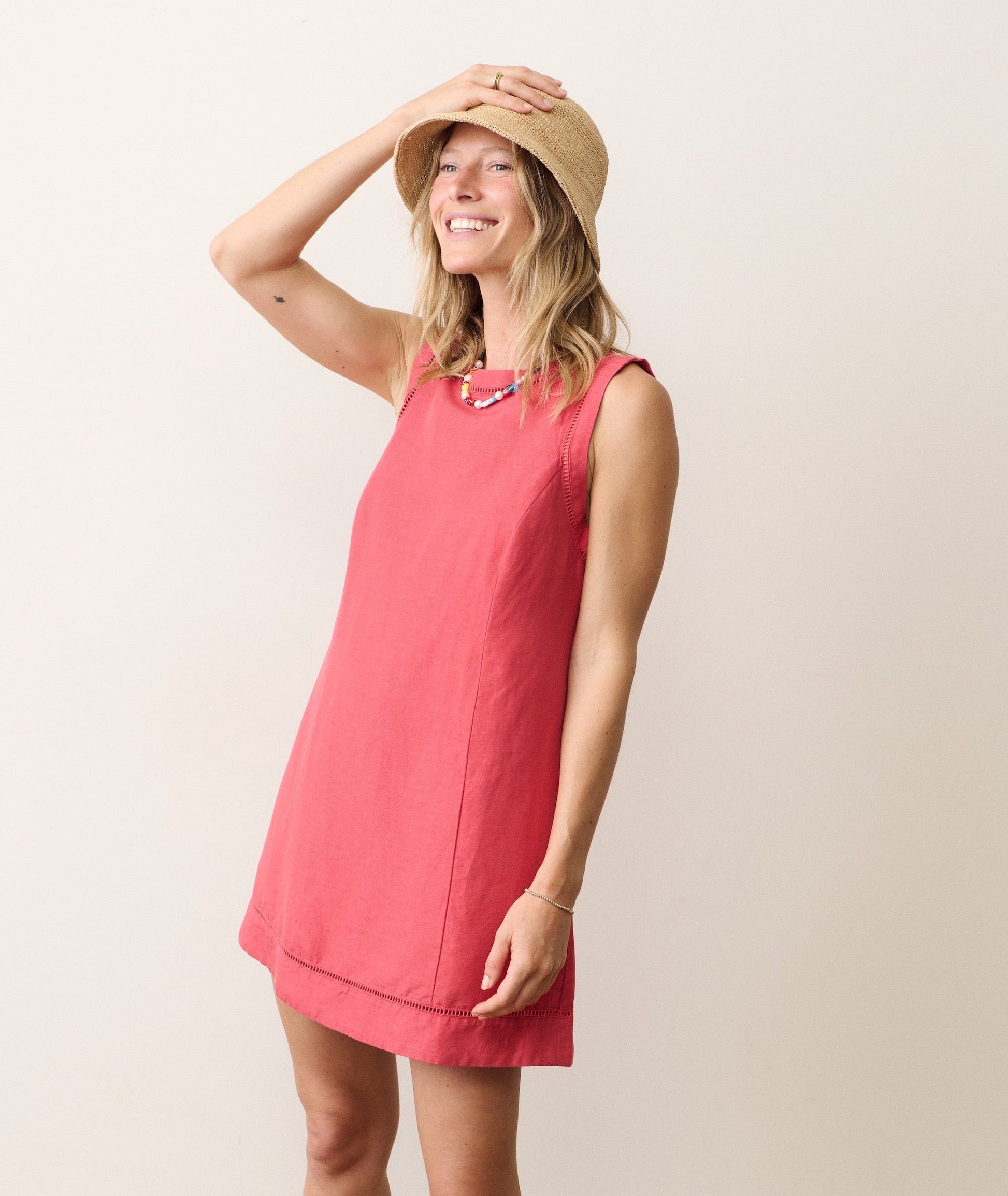 Linen mini dress on a hanger in store