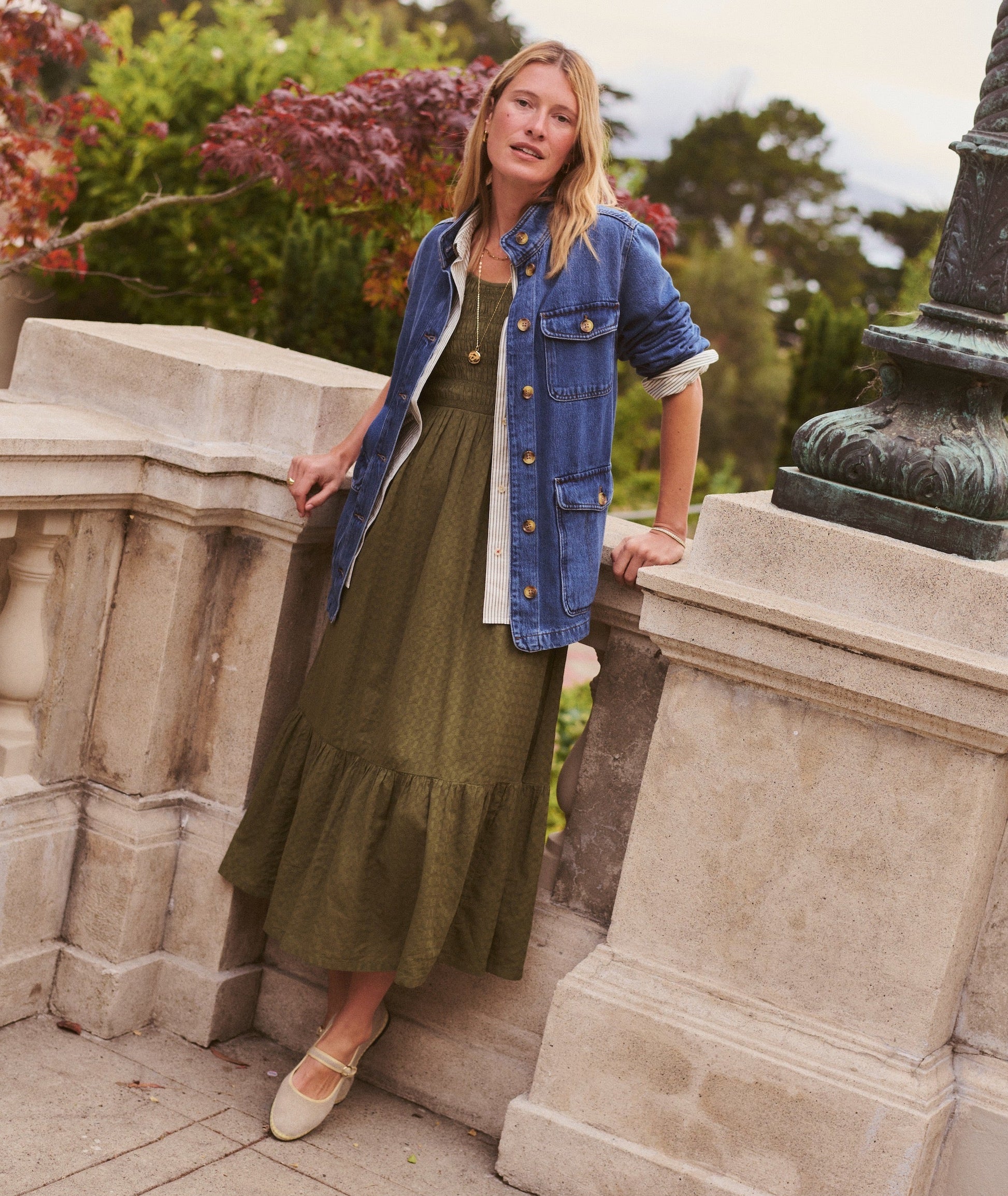 Green midi dress on a hanger in store