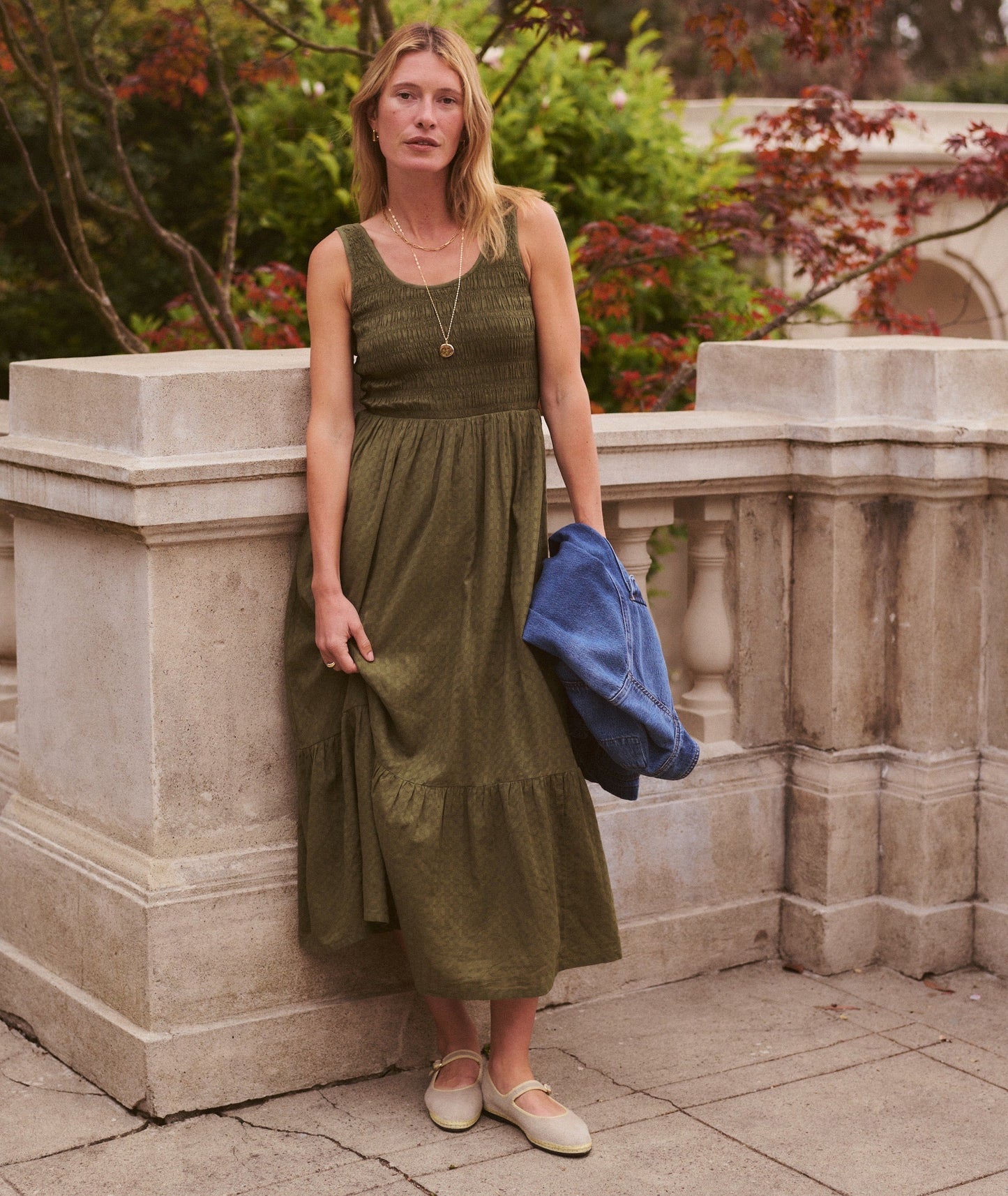 Green midi dress on a hanger in store
