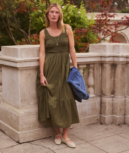 Green midi dress on a hanger in store