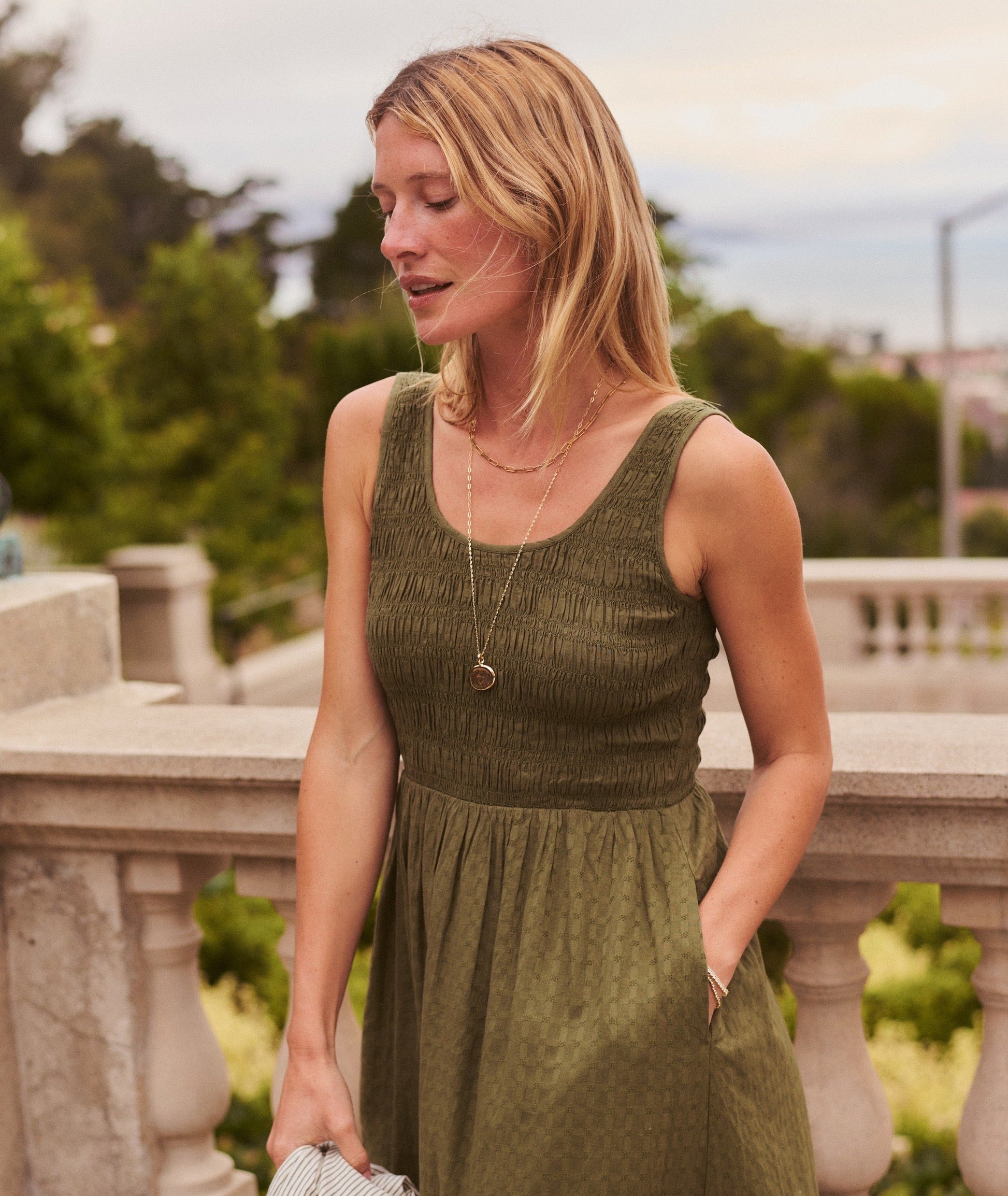 Green midi dress on a hanger in store