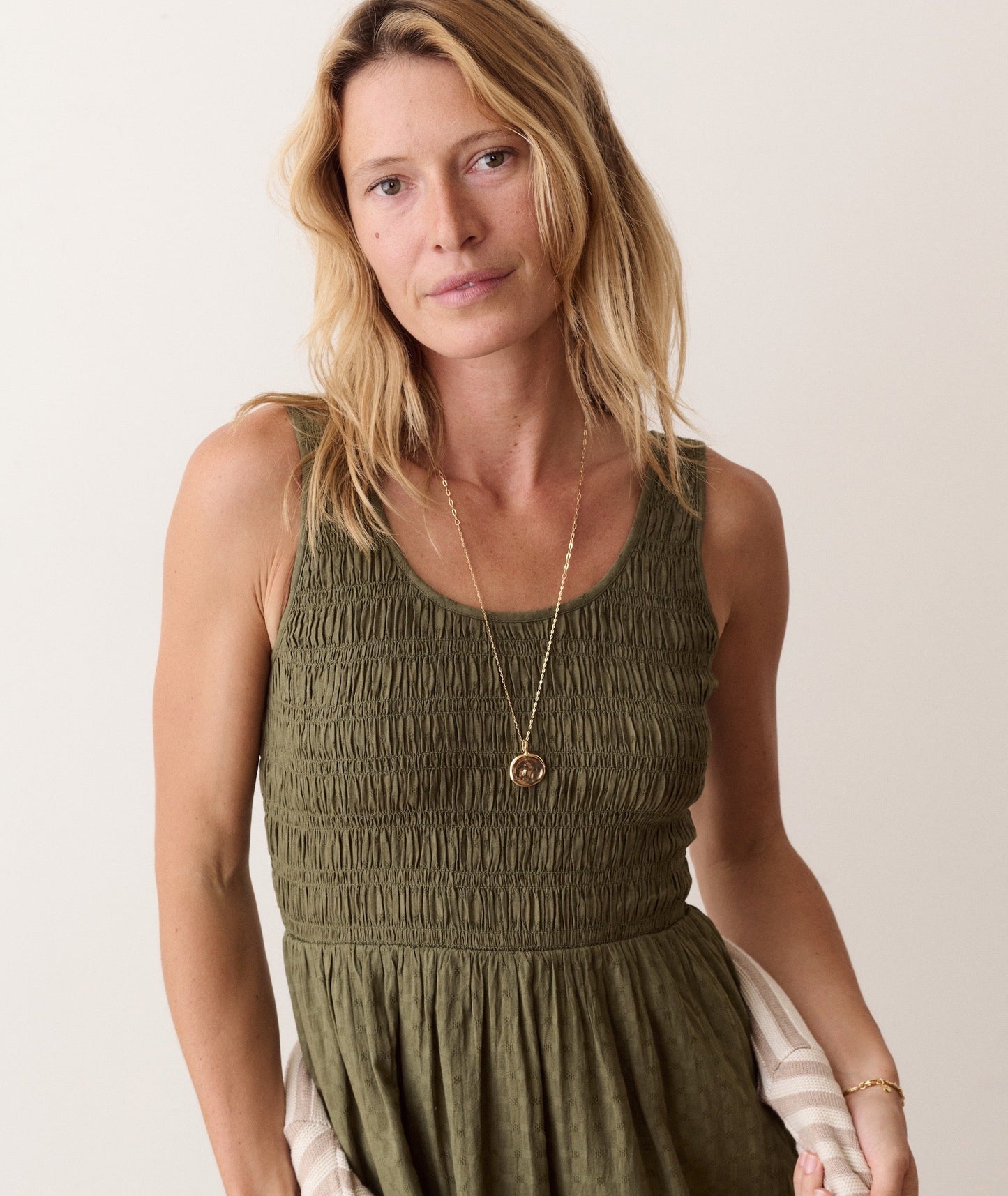Green midi dress on a hanger in store