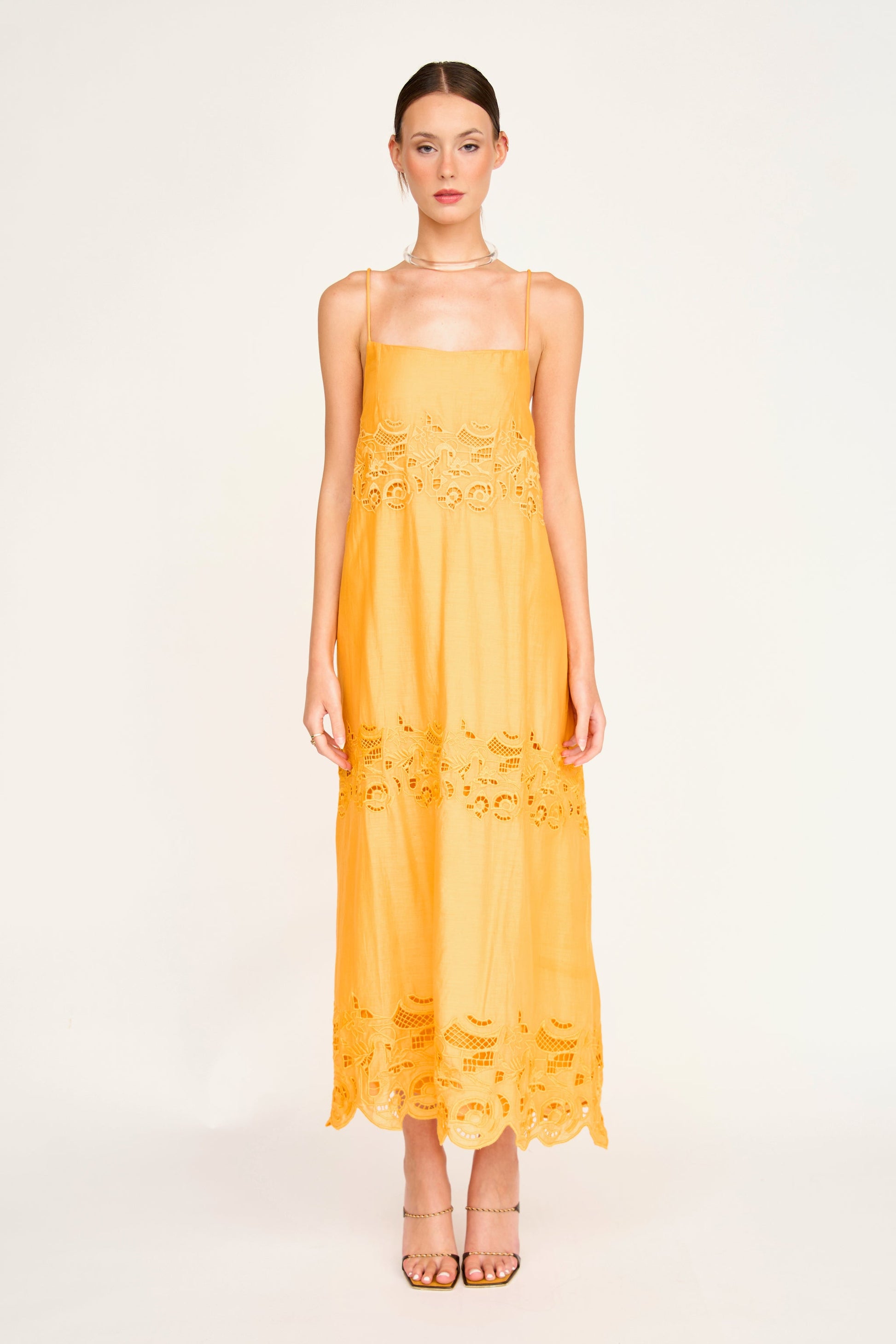 Yellow cotton maxi dress on a hanger in store