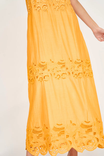 Yellow cotton maxi dress on a hanger in store