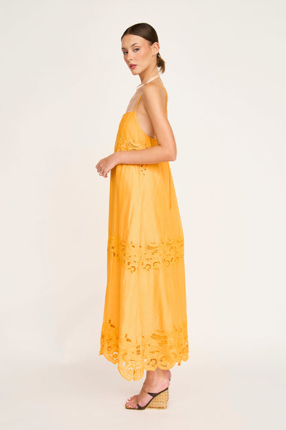 Yellow cotton maxi dress on a hanger in store